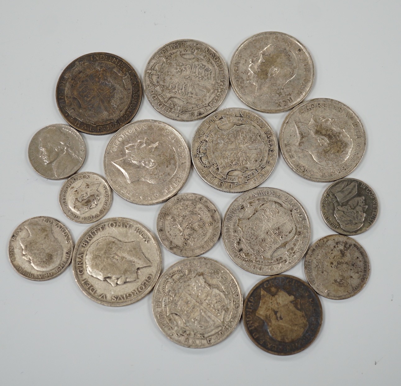 A selection of silver and cupro nickel coins, dating from Victoria to George V